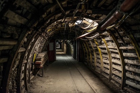 Underground coal mine tunnel with rail tracksの写真素材