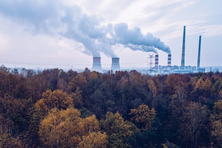Smoke over forest and power plant. Air pollutionの写真素材