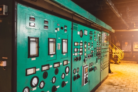 Control panel and switches in an old power plantの写真素材