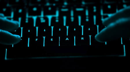 Fear - text on illuminated computer keyboard at night. Internet search conceptの写真素材