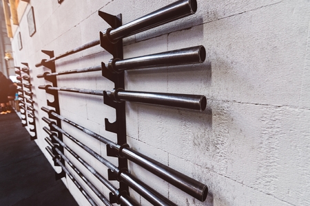 Barbell weight bars on the stand in the gym.の写真素材