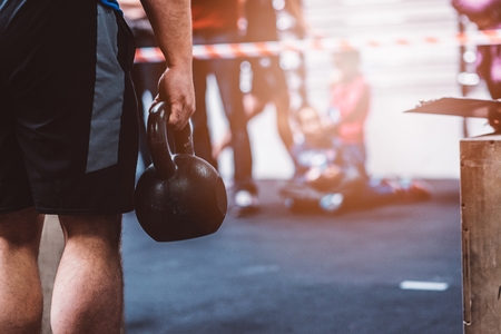 Man training with kettlebell in functional fitness gym. Kettlebell deadliftの写真素材