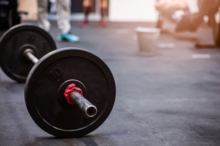 Close up on barbell on the floor in the gym.の写真素材