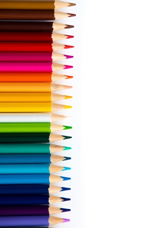 Wooden coloured pencils in row on white background. Copyspaceの写真素材