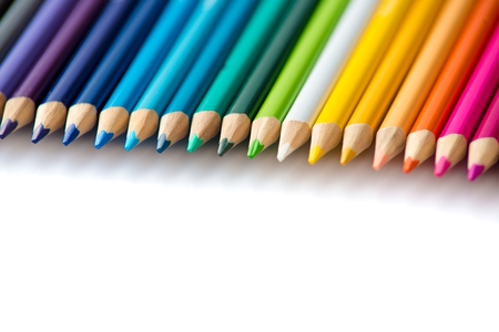 Wooden coloured pencils in row on white background. Copyspaceの写真素材