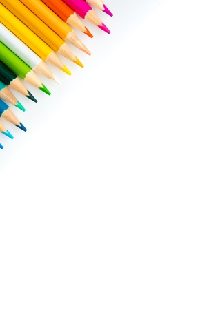 Wooden coloured pencils in row isolated on white background. Copyspaceの写真素材