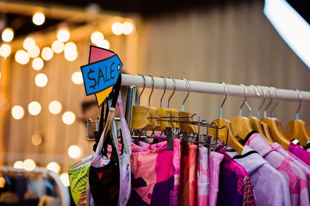 Boutique with clothes during sale. December sale