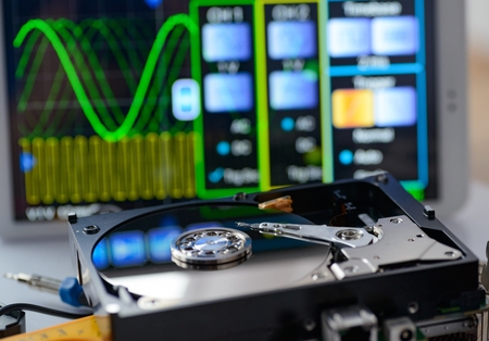Opened hard disk in service laboratory. Data recovery conceptの写真素材