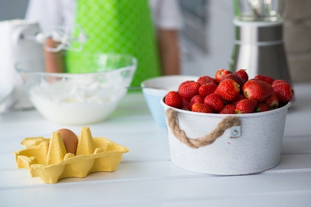 Delicious fresh red strawberries in a bowl and cake intergrients.の写真素材