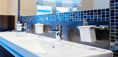 Modern washbasin faucet and washbasin in the bathroomの写真素材