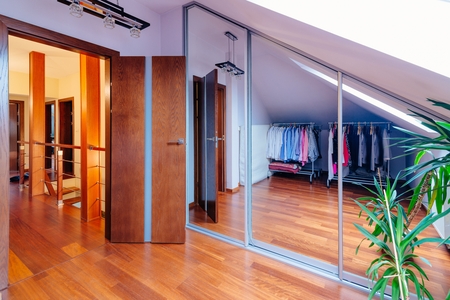 Mirrored wardrobe with large mirror doors in the wardrobeの写真素材