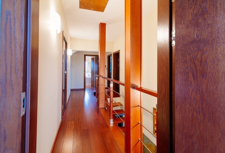 Upper hall with wooden brown stairsの写真素材