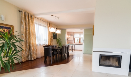 House dining room with big wooden tableの写真素材