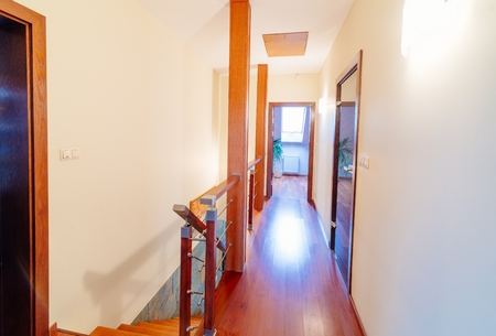 Upper hall with wooden brown stairsの写真素材