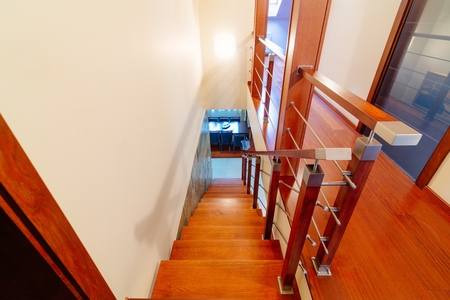 Upper hall with wooden brown stairsの写真素材