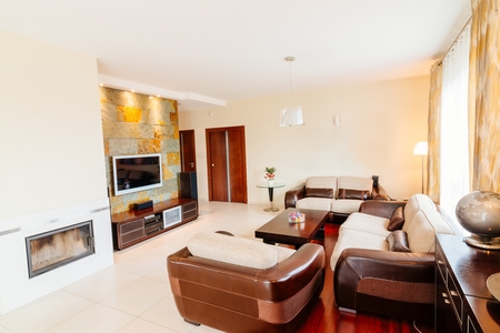 Elegant comfortable living room with sofa and armchairsの写真素材