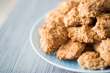 Delicious homemade sesame honey cookies on plateの写真素材