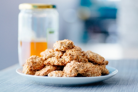 Delicious homemade sesame honey cookies on plateの写真素材
