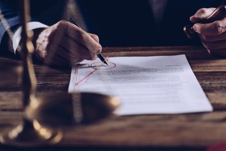 Notary public notarizes document in his office. Law conceptの写真素材