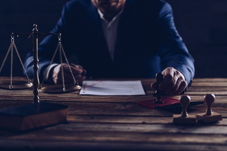 Notary public notarizes document in his office. Law conceptの写真素材