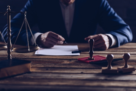 Notary public notarizes document in his office. Law conceptの写真素材