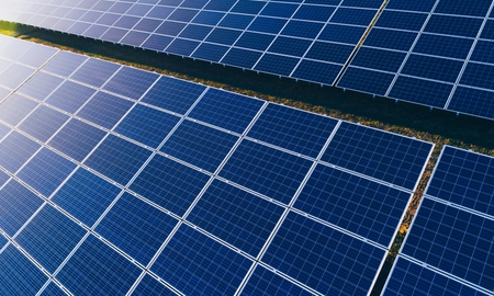 Aerial drone view on solar panels on solar farm. Green alternative renewable energy.の写真素材
