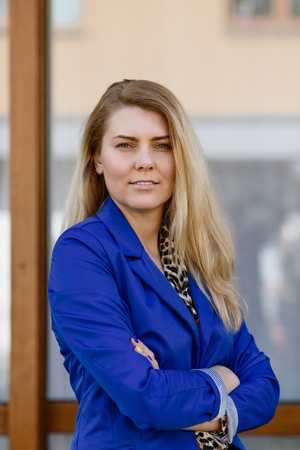 Young elegant business woman in blue jacket. Career conceptの写真素材