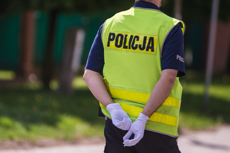 Polish policeman in reflective vest. Polish policeの写真素材
