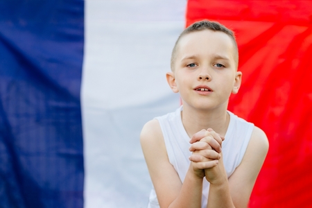 Happy child boy with France national flag. French football fanの写真素材
