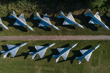 Aerial drone view on military airbase with old Russian jet fighters. Airplanes cemeteryのeditorial素材