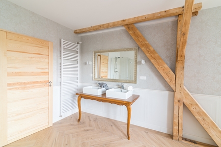 White wash basins in loft bathroom. Modern, bright attic apartment.の写真素材