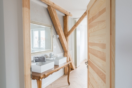 White wash basins in loft bathroom. Modern, bright attic apartment.の写真素材