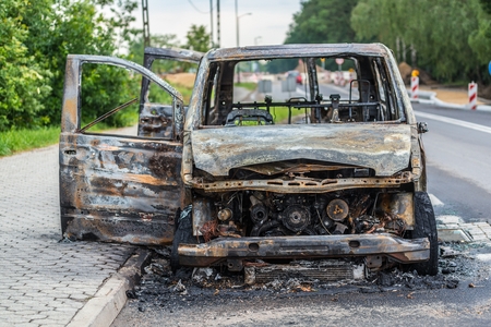 Burnt car on road. Car accidentの写真素材