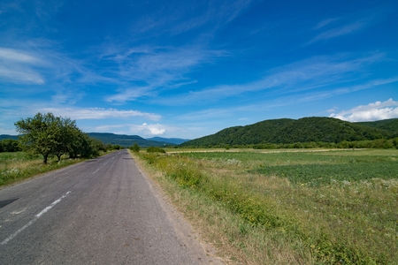 Ukrainian country road at summer. Carpathian Mountains in Ukraineの写真素材