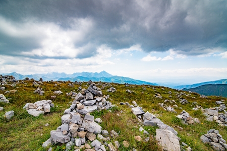 Stone piles on mountain trail in Polish Tatra mountainsの写真素材
