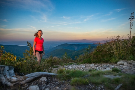 Young beautiful woman on mountain trail. Szczyrk, Beskidy Mountains, Polandの写真素材