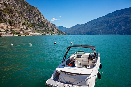 Motor boat on Lake Garda in Limone sul Garda, Lombardy, Italyの写真素材