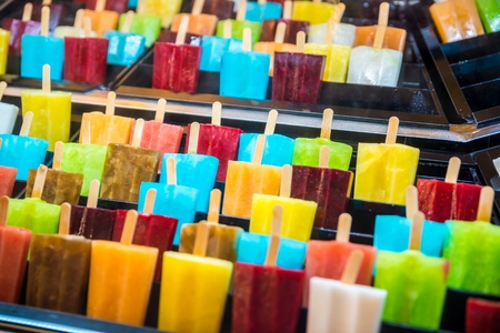 Delicious fresh colourful ice lolly on stick. Freshly made fruit ice creamsの写真素材