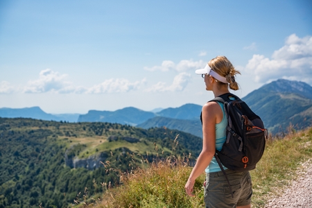 Woman on mountain trail. Female in Italian Alps, Monte Baldo mountainの写真素材