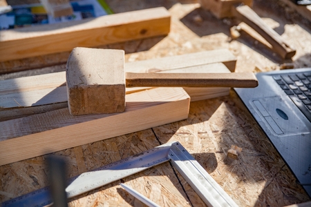 Wooden mallet and metal bracket with other carpenter's tools. Woodworking, construction conceptの写真素材
