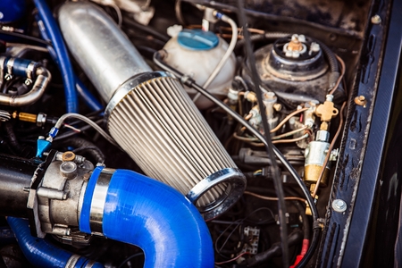 Sport air filter in a gasoline turbocharged car engine. Car tuning