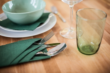Table setting with fork spoon and knife on wooden tableの写真素材