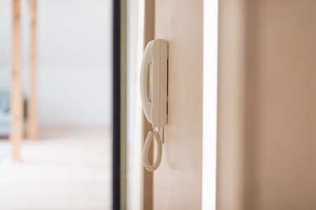 White home doorbell intercom mounted on the wallの写真素材