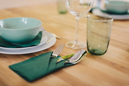 Table setting with fork spoon and knife on wooden tableの写真素材