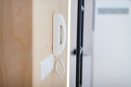 White home doorbell intercom mounted on the wallの写真素材