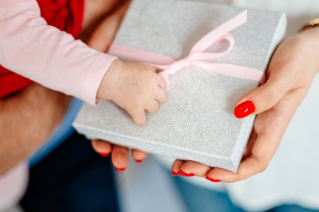 Woman giving box with ribbon surprise gift. Christmas present giftの写真素材