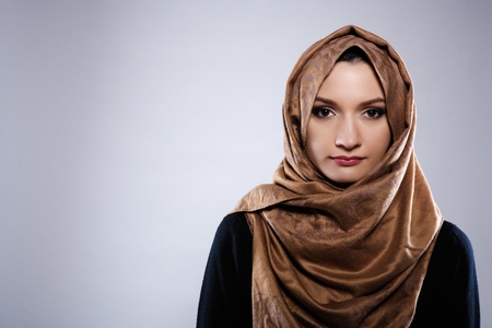 Young arabic woman in hijab, studio shotの写真素材