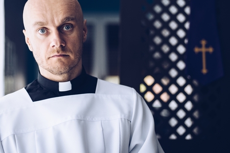 Catholic priest in church. Faith and religionの写真素材