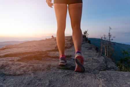 Woman cross country runner legs in mountains at summer. Woman running. Silesian Beskid, Szczyrkの写真素材