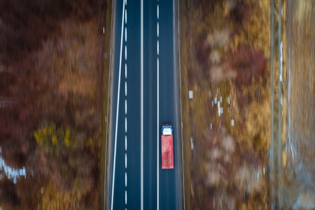 Aerial drone view on TIR truck on asphalt road. Transport and logistic conceptの写真素材